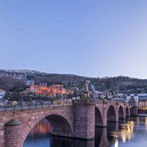 Illuminated Heidelberg castle and Alte Brucke (Old Bridge) in winter at night, Baden-Wurttemberg