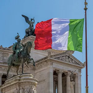 Italian flag waving in front of the National Monument to Victor Emmanuel II (Altare della Patria), Rome, Lazio, Italy