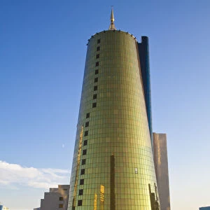Kazakhstan, Astana, Twin golden-green, conical business centre
