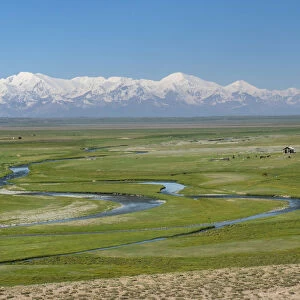 Landscape of valley near Sary Tash with Pamir mountains in the background