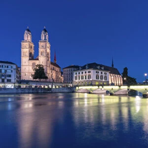 Limmatquai, Grossmunster Cathedral and Munsterbrucke bridge at dusk, Zurich, Switzerland