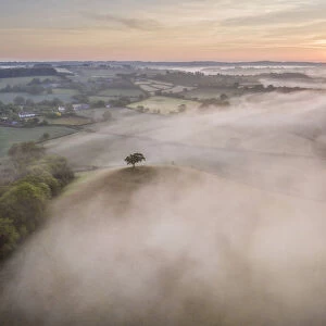 Misty sunrise over the beautiful countryside of Mid Devon, England. Spring (May) 2020