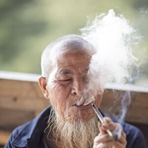 Old man smoking pipe, Longji, Longshen, Guangxi, China