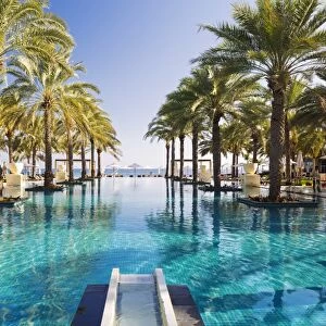 Oman. Muscat Governorate, Muscat. The 50 metre infinity pool at the Ritz Carlton
