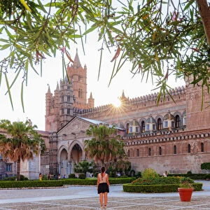 Palermo, Sicily. Tourists visiting the baroque Cathedral at sunset
