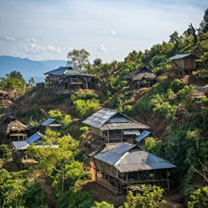 Remote village of Eng tribe built on a slope in mountains near Kengtung