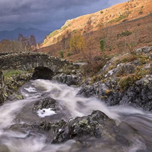 Rocky stream tumbling under Ashness Bridge in the Lake District National Park, Cumbria