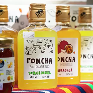 Small bottles of poncha on display at Farmers Market (Mercado dos Lavradores), Funchal, Madeira, Portugal