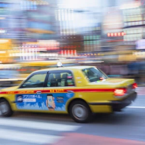 Taxi passing through Shibuya Crossing, Shibuya, Tokyo, Japan