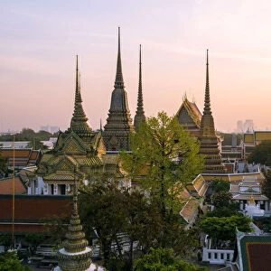 Thailand, Bangkok. Wat Pho complex, elevated view, at sunrise