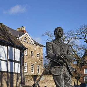 UK, England, Herefordshire, Hereford, Edward Elgar Statue leaning against his Sunbeam bicycle infront of Cathedral barn