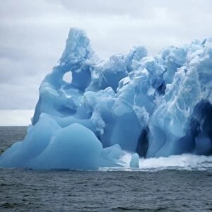 Detail of blue iceberg full of holes and cavities. Antarctic Sound, Antarctic Peninsula, Antarctica