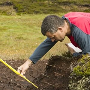 A scientist looking at peat erosion in the north Pennines UK