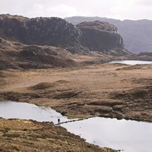 Stepping stones across a loch between Loch Nevis and Loch Morar Scotland