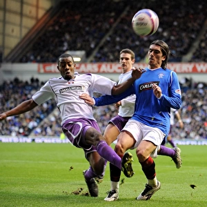 Intense Rivalry: Pedro Mendes vs Simon Ford - Battle for the Ball in Rangers vs Kilmarnock's Clydesdale Bank Premier League Clash at Ibrox (3-1)