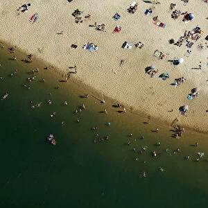 An aerial view shows people cooling off at a beach on the shores of the Silbersee lake