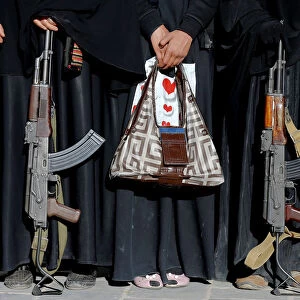 Armed women attend a rally to show support to the Houthi movement in Sanaa, Yemen