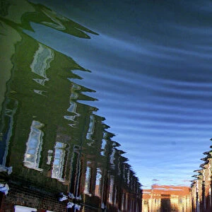 COLENSO STREET IN YORK CREATES ABSTRACT PATTERNS AS IT IS REFLECTED IN FLOOD