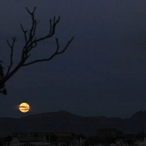 The end of a total lunar eclipse is seen in Ciudad Juarez
