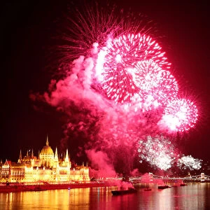 Fireworks explode over Danube River during Saint Stephens Day in Budapest