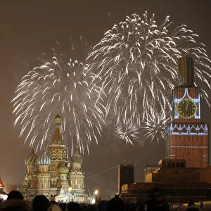 Fireworks light the sky over St. Basils Cathedral and Kremlins Spasskaya Tower