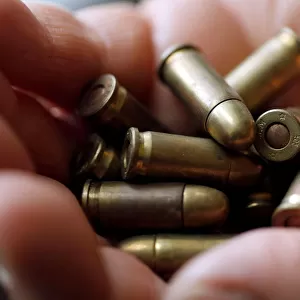A guns collector holds 7. 65 caliber bullets in his house in Bordeaux