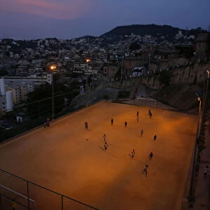 Kids play soccer during a training session at Sao Carlos slum in Rio de Janeiro