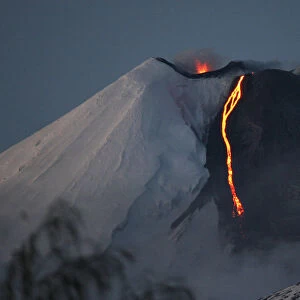 The Llaima volcano spews lava in Cherquenco town