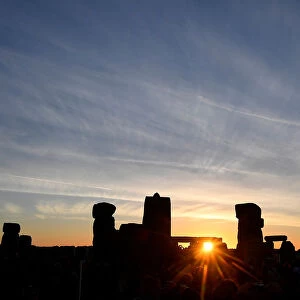 Revellers welcome in the Summer Solstice at Stonehenge stone circle in southwest Britain