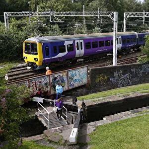 A train passes a canal in Stoke-on-Trent