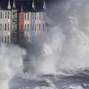 Waves hit the seawall during heavy seas and high winds in Dawlish in south west Britain