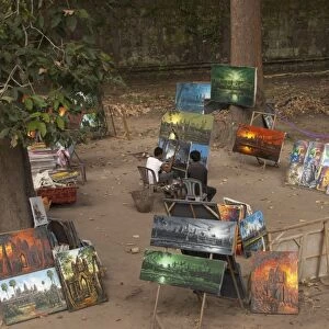 Men selling paintings at Khmer temple, Angkor Thom, Angkor, Siem Riep, Cambodia