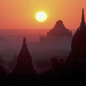 Asia, Burma, (Myanmar), Pagan (Bagan) The temple complex of Pagan at dawn. Gilded