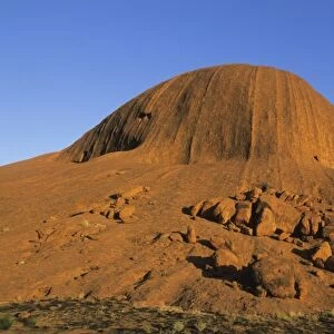 Australia, Uluru, Ayers Rock, sandstone massif, sunrise at base of rock