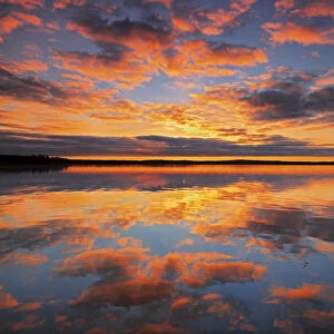 Canada, Saskatchewan, Prince Albert National Park. Sunrise on Namekus Lake. Credit as