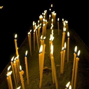 Candles burning in the Armenian orthodox church at Geghard monastery near Garni