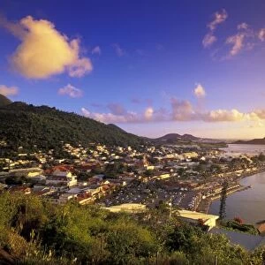 Caribbean, French West Indies, St. Martin. Marigot; town seen from Ft. Louis; sunset