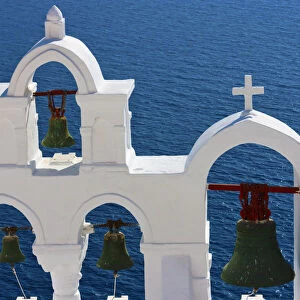 Church bell tower on the coast of Aegean Sea. Oia, Santorini Island, Greece