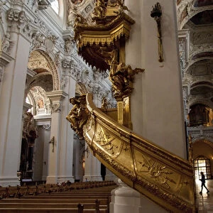Germany, Passau. St. Stevens Cathedral, baroque interior. Gold spiral staircase