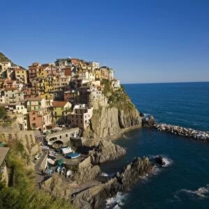 Italy, Cinque Terre, Manrola, Hillside Town of Manrola with the Mediterranen Sea