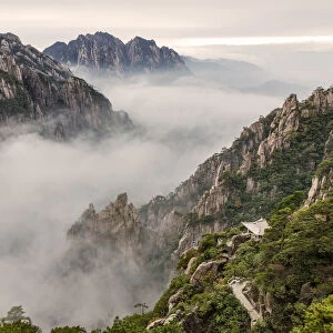 Mountain peaks and mist from above at sunrise, Yellow Mountain or Huangshan