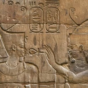 Relief depicting Egyptian divinity giving the Ankh to a pharaoh. Temple of Luxor. Egypt