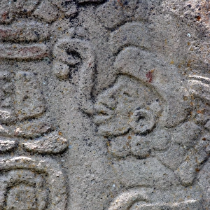 Detail of a rock carving by a Zapotec artist at Monte Alban archeologic site near Oaxaca