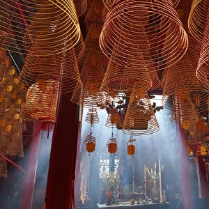 Smoke and incense coils, inside Ong Pagoda, Can Tho, Mekong Delta, Vietnam