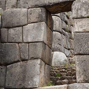 South America, Peru, Cuzco. Inca stone walls, stairs and door at Fort Sacsayhuaman ruins