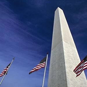 USA, District of Columbia. American flags fly at the base of the Washington Monument