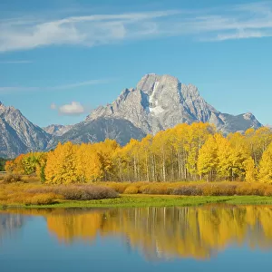 Wyoming, Grand Teton National Park. Mount Moran and golden Aspen trees, reflected in Snake River at Oxbow Bend