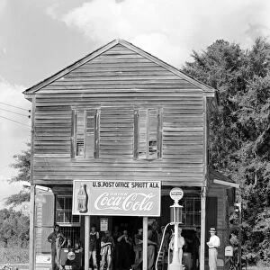 ALABAMA: POST OFFICE. A crossroads Post Office with a general store and a gas pump in Sprott, Alabama. Photograph by Walker Evans, c1935-1936