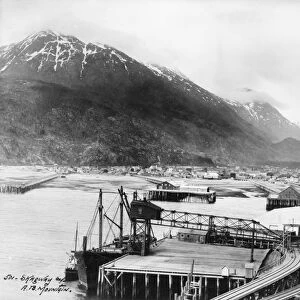 ALASKA: SKAGWAY, c1912. View of the railroad tracks and pier on the Taiya Inlet