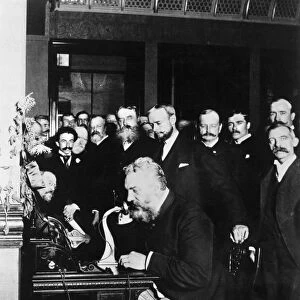 ALEXANDER GRAHAM BELL. Bell at the New York end of the first long-distance telephone